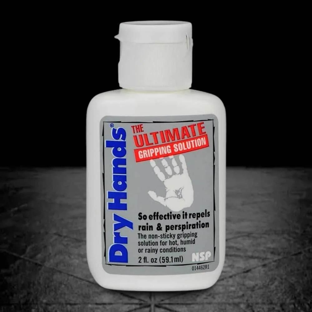 Bottle of Dry hands liquid magnesium in the center of the picture with a black background