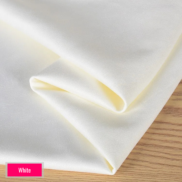White stretch fabric for platform protector, suitable for 10cm platform pole dance shoes, shown folded on wooden surface