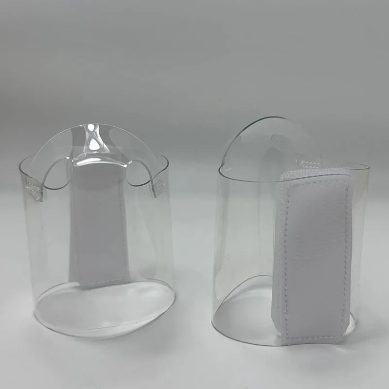 Pair of Transparent platform protectors with a white rear hook-and-loop closure heel one shown from the front the other from the back