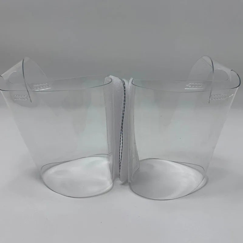 Pair of Transparent platform protectors with a white rear hook-and-loop closure heel shown from the side