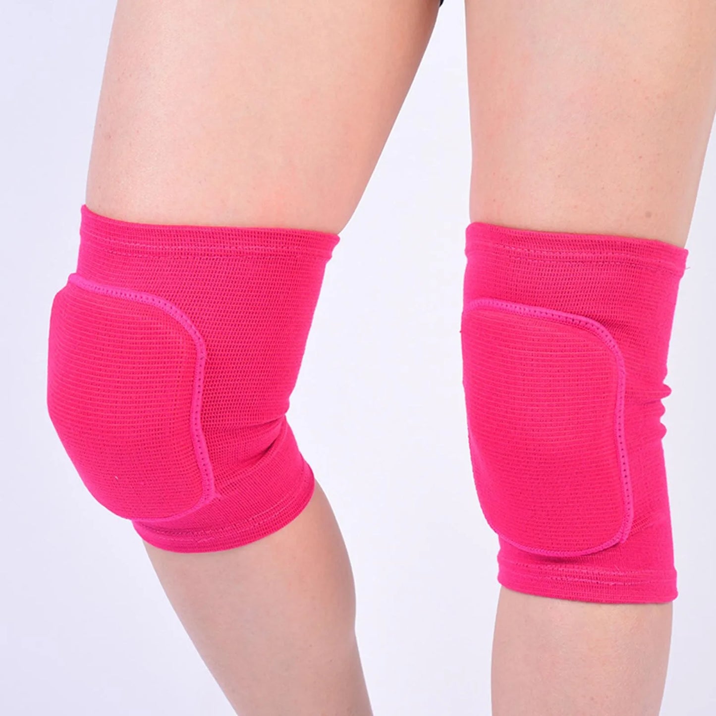 Hot Pink closed knee pads with padded knee protection worn on legs, elastic ribbed fabric.