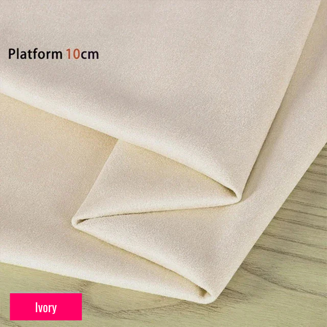 Ivory stretch fabric for platform protector, suitable for 10cm platform pole dance shoes, shown folded on wooden surface