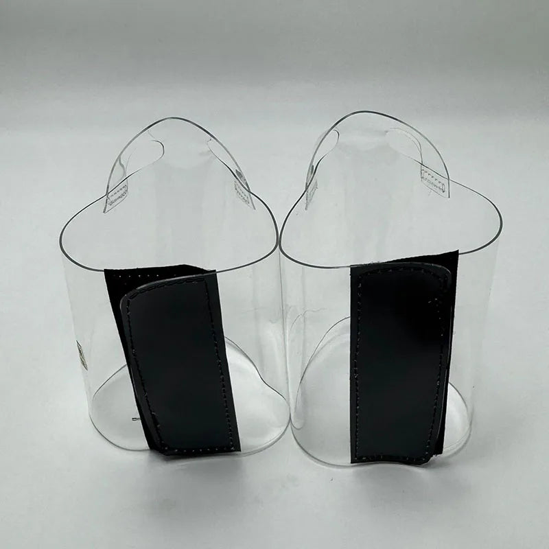 Pair of Transparent platform protectors with a black rear hook-and-loop closure heel shown from the back