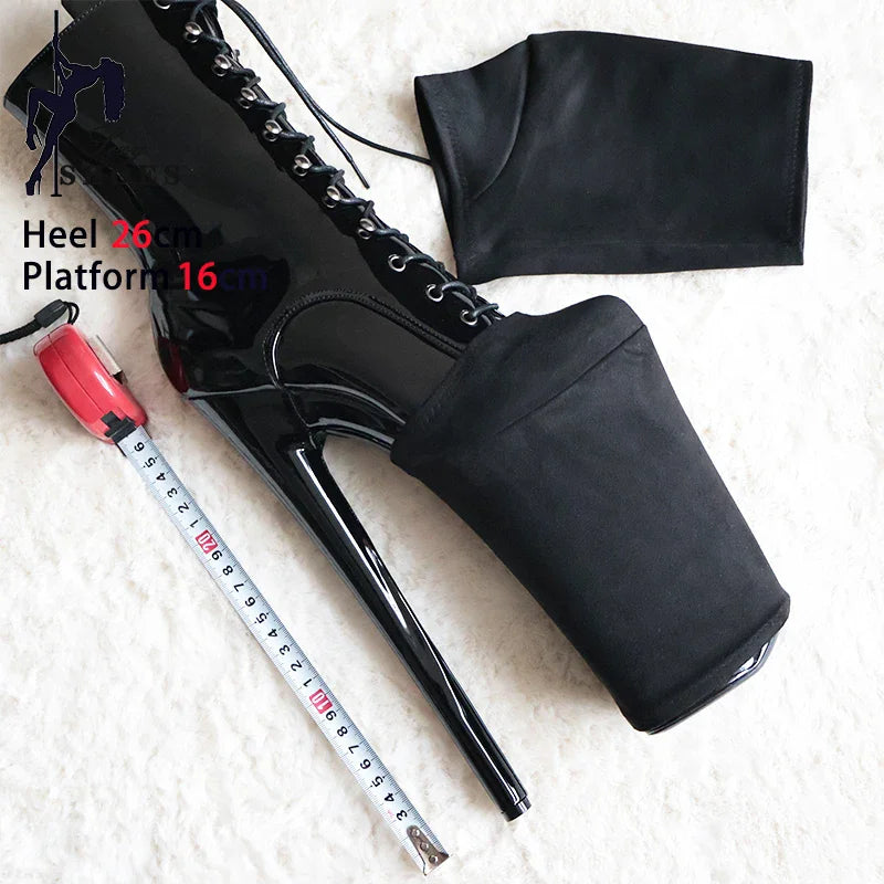 Black platform protector cover fitted to a high-heeled pole dance boot with 26cm heel and 16cm platform, size labels visible, with measuring tape for height reference.