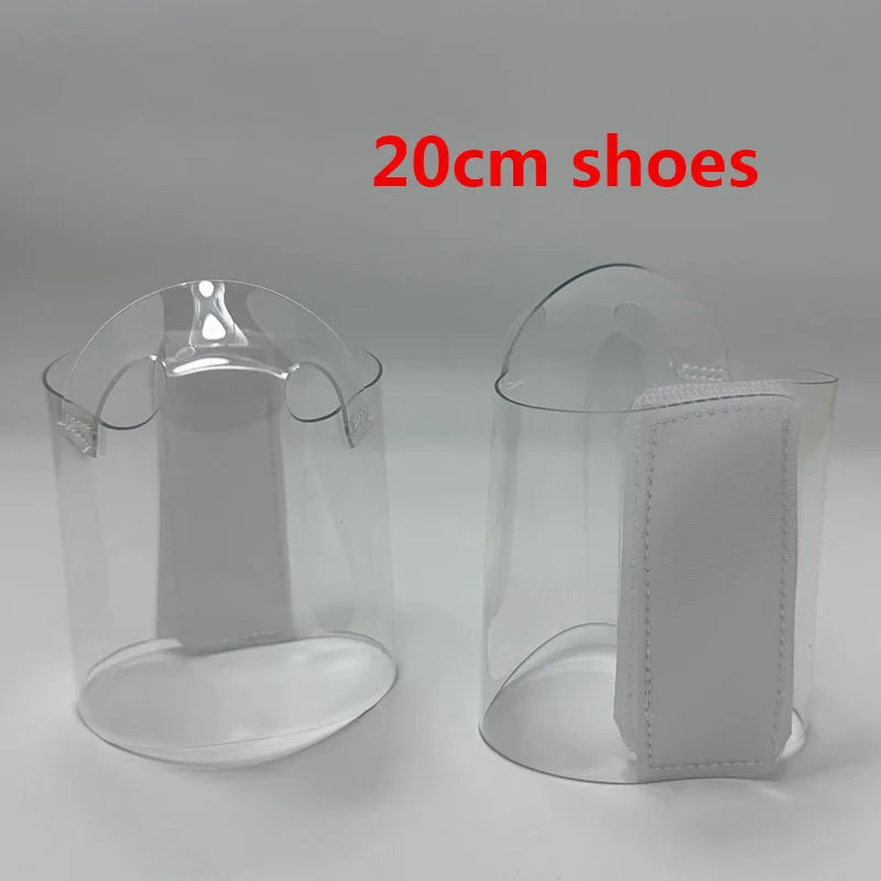 Pair of Transparent platform protectors with a white rear hook-and-loop closure for 20 cm pole dance heels”