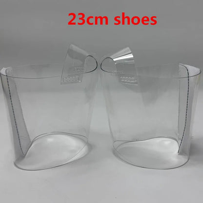Pair of Transparent platform protectors with a white rear hook-and-loop closure for 23 cm pole dance heels