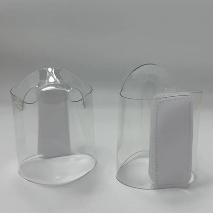 Pair of Transparent platform protectors with a white rear hook-and-loop closure heel one shown from the front the other from the back