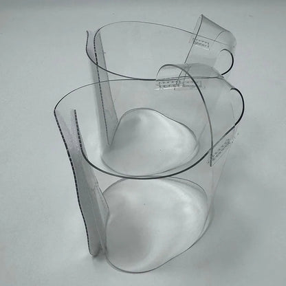 Pair of Transparent platform protectors with a white rear hook-and-loop closure heel shown from the side