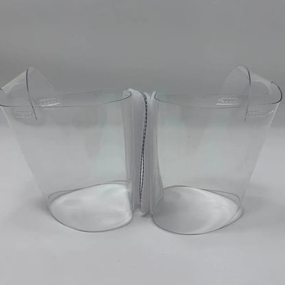 Pair of Transparent platform protectors with a white rear hook-and-loop closure heel shown from the side