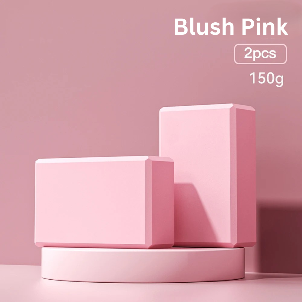 Two blush pink high-density foam yoga blocks on a blush pink display stand, indicating 'blush pink, 2pcs, 150g'.