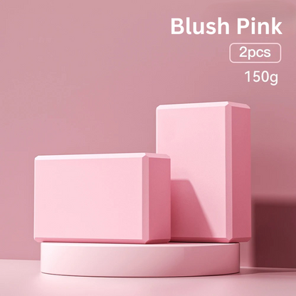 Two blush pink high-density foam yoga blocks on a blush pink display stand, indicating 'blush pink, 2pcs, 150g'.
