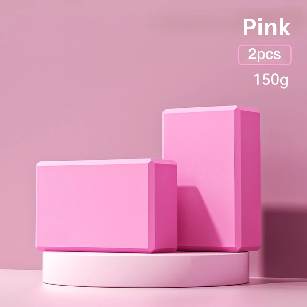 Two pink high-density foam yoga blocks on a pink display stand, indicating 'pink, 2pcs, 150g'.