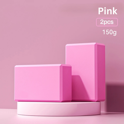 Two pink high-density foam yoga blocks on a pink display stand, indicating 'pink, 2pcs, 150g'.