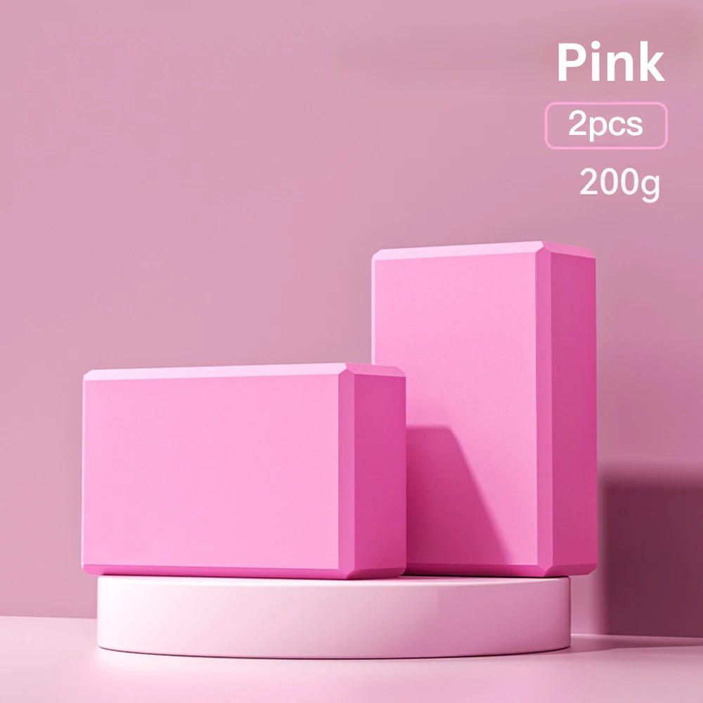 Two pink high-density foam yoga blocks on a pink display stand, indicating 'pink, 2pcs, 200g'.