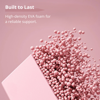 Artistic image of a pink yoga block with a cutout, from which numerous small pink spheres are spilling out. Text reads 'Built to Last. High-density EVA foam for a reliable support.